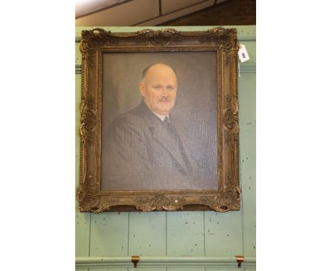 AN EARLY 20TH CENTURY OIL ON CANVAS, half length portrait of a man, signed, Wales, 24 ins x 20 ins, in an Ornate gilt frame. 