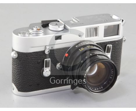 A Leica M4 Rangefinder camera, chrome, rare serial no. 331A with Leitz Summicron-M f/2 50mm lens, black, serial no. 3357940