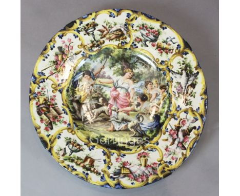 A large Italian maiolica charger, decorated with a stag hunting scene, label inscribed 'bought at the Monastery of San Martin