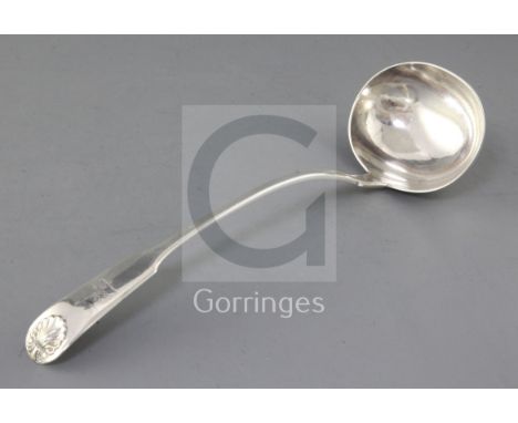 A Victorian provincial silver fiddle and shell pattern soup ladle, by John Walton, with engraved crest, Newcastle, 1851, 33cm