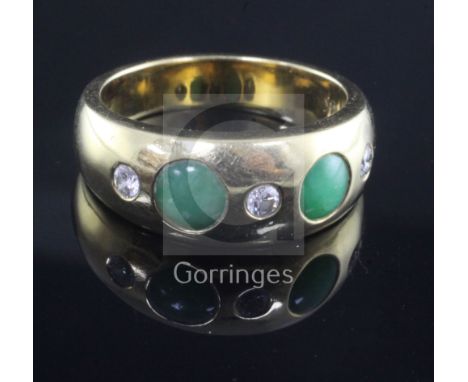 An 18ct gold and gypsy set jade and diamond five stone ring, size X.