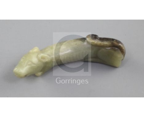 A Chinese yellow and black jade carving of a dog, Song dynasty or later, the hounds elongated body of greenish yellow tone wi