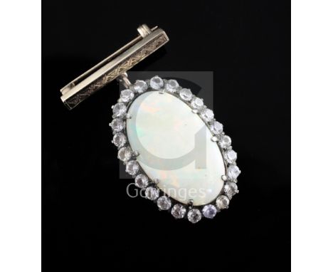 An early 20th century gold, white opal and white sapphire set oval pendant, with bar brooch attachment, opal length 25mm.