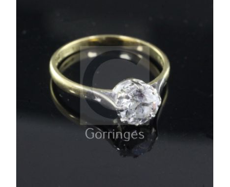 A 1980's 18ct gold and solitaire diamond ring, the round cut stone weighing approximately 1.25cts, size R.