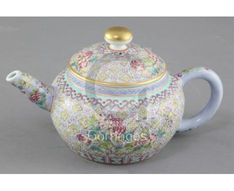 A Chinese enamelled porcelain wine pot and cover, painted with peonies and other flowers on a diaper pattern pale blue ground