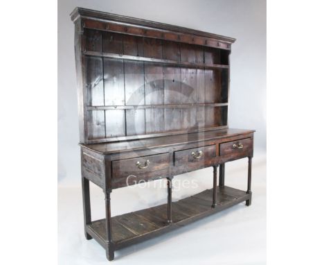 A George III oak dresser, with three shelf rack and three long drawers over plain column legs, pot board and stile feet, W.6f