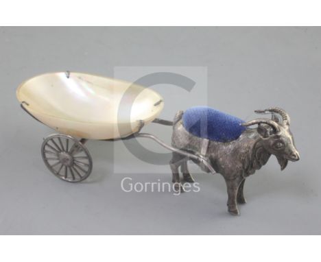 An Edwardian novelty silver billy goat and cart pin cushion, with mother of pearl cart on two moveable wheels, by Adie & Love