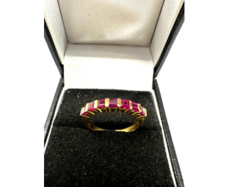 18ct gold ruby ring set with 7 rubies weight 3.2 
