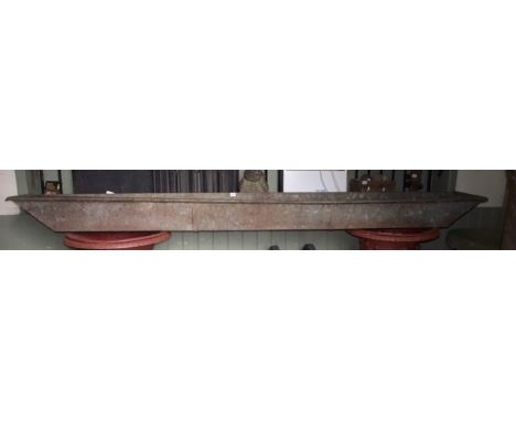 An unusual shallow galvanised boat shaped trough with ribbed interior, 280 cm long x 35 cm wide x 19 cm in height approx