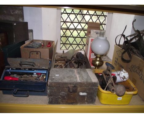A quantity of vintage and later carpentry and other related hand tools to include: planes, saws, spanners, etc, and a Tilley 