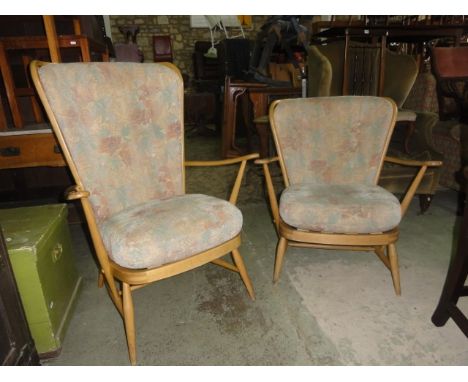 An Ercol light beechwood framed high hoop and stickback open armchair raised on splayed supports, together with a similar sma