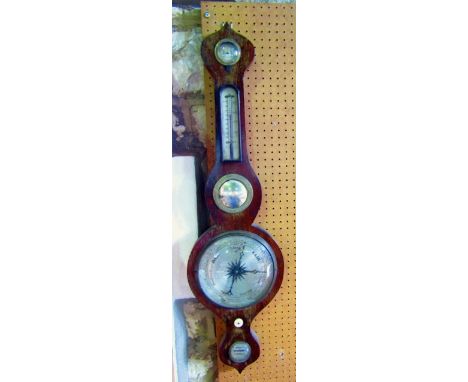 A 19th century mahogany barometer with onion shaped top, with silvered dials