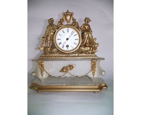 A Victorian gilt spelter and alabaster mantel clock in the classical style enclosing an enamelled dial and eight day timepiec