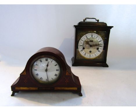 A small Edwardian mantel clock, the mahogany case with inlay detail enclosing an eight day timepiece together with a reproduc