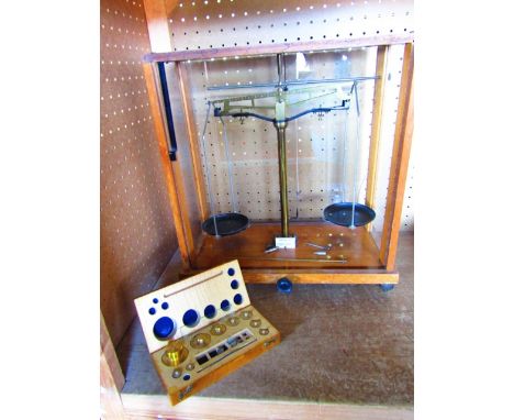 A 20th century timber cased set of laboratory scales with plaque reading W & J George & Becker Limited, London & Birmingham w