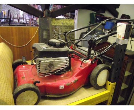 A Sovereign self-propelled petrol rotary lawn mower with Briggs and Stratton engine and grass collection box
