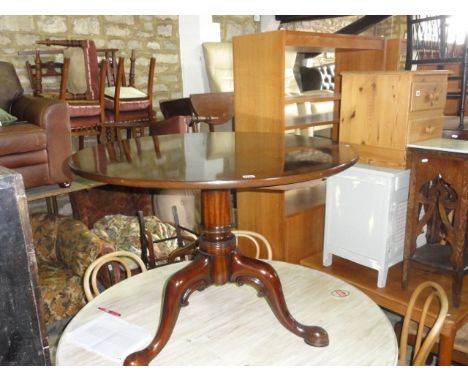 A Georgian style mahogany dining/occasional table, the circular top raised on a turned pillar and shaped tripod, 103 cm in di