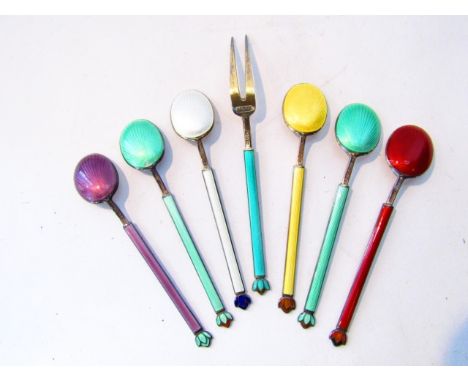 A set of six Norwegian silver, gilt and enamelled demitasse spoons, David Andersen, Oslo, each with vari coloured guilloche e