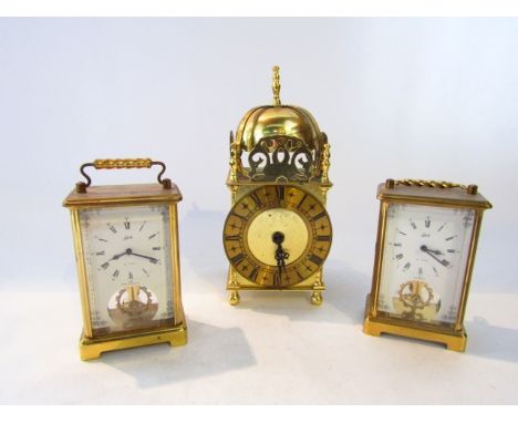 A reproduction lantern clock in an Old English style with brass case together with two short Schaltz brass carriage clocks