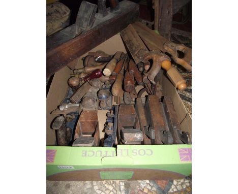 A box of vintage wood and other working tools to include various planes, chisels, tool bags, etc