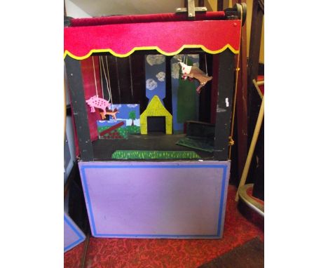 A home built wooden framed puppet theatre and accessories