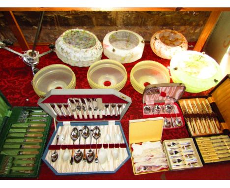 A collection of four various marbled glass ceiling shades, a three branch hanging ceiling light with Art Deco style glass sha