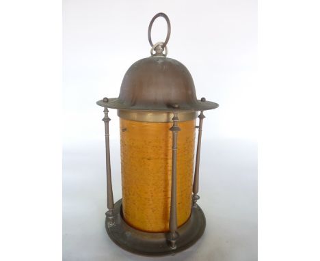 A brass framed ceiling lantern with turned column supports and later orange composite shade stamped L T Dean, 40 cm tall appr