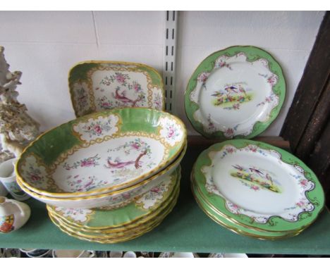 A set of six dessert plates with painted bird decoration within green, gilt and floral borders, with retailer mark to reverse