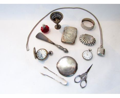 An Edwardian silver sovereign case, maker's mark "J.T", Birmingham, 1902, of shaped rectangular form, flat-chased with scroll