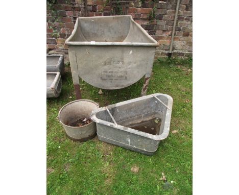 A galvanised steel freestanding trough of rectangular form with half barrel shaped reservoir together with a further galvanis