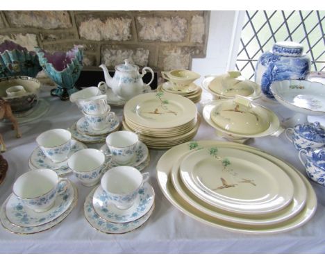 A collection of Royal Doulton The Coppice dinnerwares pattern number 5803 comprising: three oval graduated meat plates, a pai