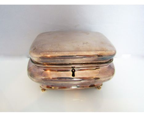 A good quality silver-plated caddy, of bombe form, with hinged locking lid raised on four swept supports