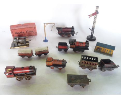 A quantity of antique 0 gauge model railway effects to include a tin plated engine stamped to underside DRGM 1180946, marked 