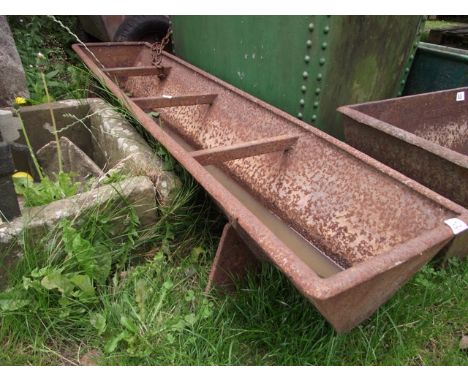 A vintage cast iron three divisional feeding trough of rectangular form with tapered sides and internal channel, approx 5ft l