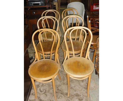 A set of six light beechwood Bentwood café chairs with circular seats