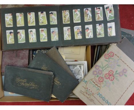 A collection of cigarette card albums including a series of Cricketer Caricatures by R I P, further loose cigarette cards inc