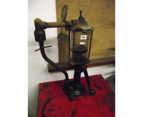 A vintage Esso lube motor oil pump/dispenser, together with a further Esso lube galvanised steel eight-divisional oil bottle 