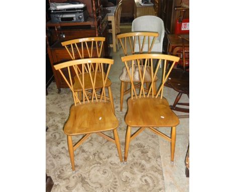 A set of four vintage Ercol light elm and beechwood Chiltern dining chairs with crossed stick backs and tapered supports, uni