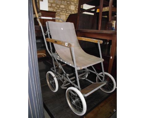 A vintage Allwin trademark wheelchair with folding steel frame, wire spoke wheels and hard rubber tyres