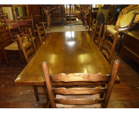 A good quality reproduction oak refectory table in the old English style, by Titchmarsh and Goodwin, the rectangular top with