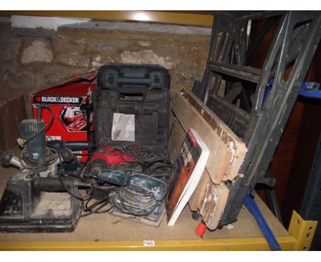 A selection of Black and Decker workshop power tools to include: a KW780 router, two KA175 sanders, a boxed Black and Decker 