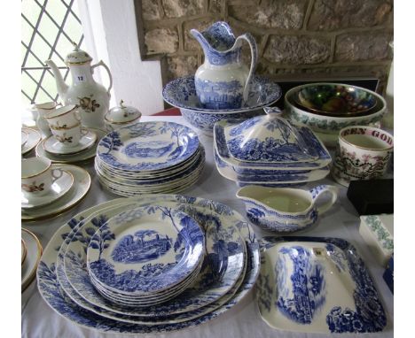 A collection of Pountney and Co. blue and white printed dinner wares showing Thames scenes and comprising: three oval graduat