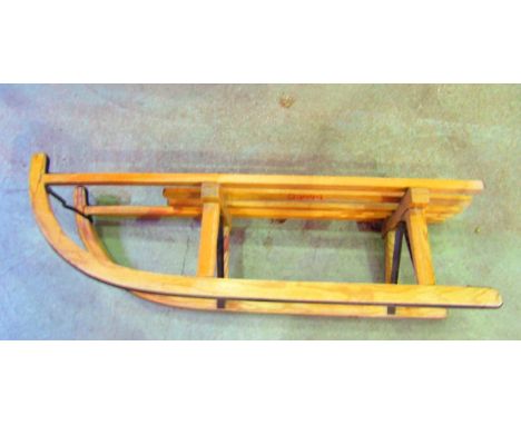 A vintage wooden tobogan, with slatted seat and iron fittings (transfer label Hohnberg Rodel)