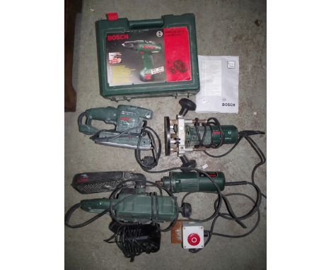 A selection of Bosch electric powered tools to include: a P0F500A router, a PSS23 sander, a further PBS60 sander, a PSR9,6VE-