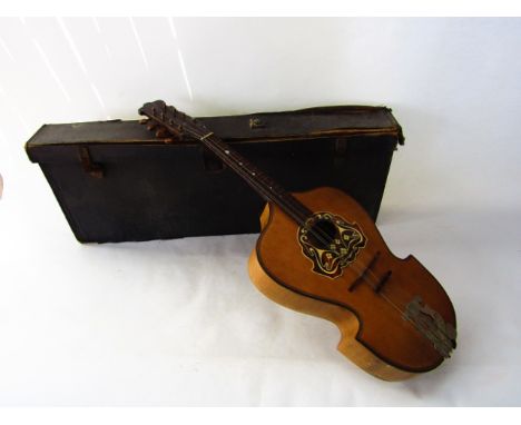A mandolin with label to soundhole interior reading 'No. 2244 Viennese College of Music, by his Majesty's Royal Letters Paten