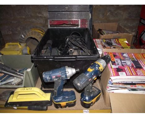 A Ryobi battery rechargeable 18 volt power drill CHI-1802, serial number 018872, a further Ryobi drill BID-1801, a 110 volt t
