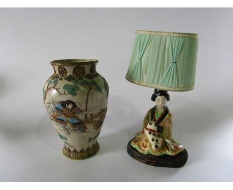 A late 19th century Japanese Kyoto type vase with relief moulded and painted decoration of male warriors in a landscape setti