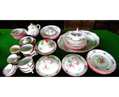 A quantity of French Luneville floral decorated dinner and teawares including an oval meat plate, three circular covered dish