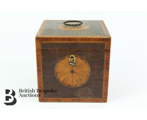 Wooden tea caddy with key, measures approx. 11cm x 11cm x 11cm.&nbsp;