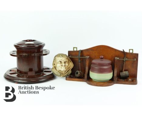Early 20th century smoker's stand. The circular stand having carved segments to house eight pipes centred by a tobacco jar an